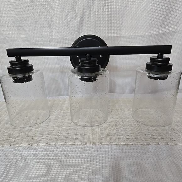 NWB Craftmade Bolden 3 Light Vanity Flat Black Clear Seeded Glass 24x 9 Inch